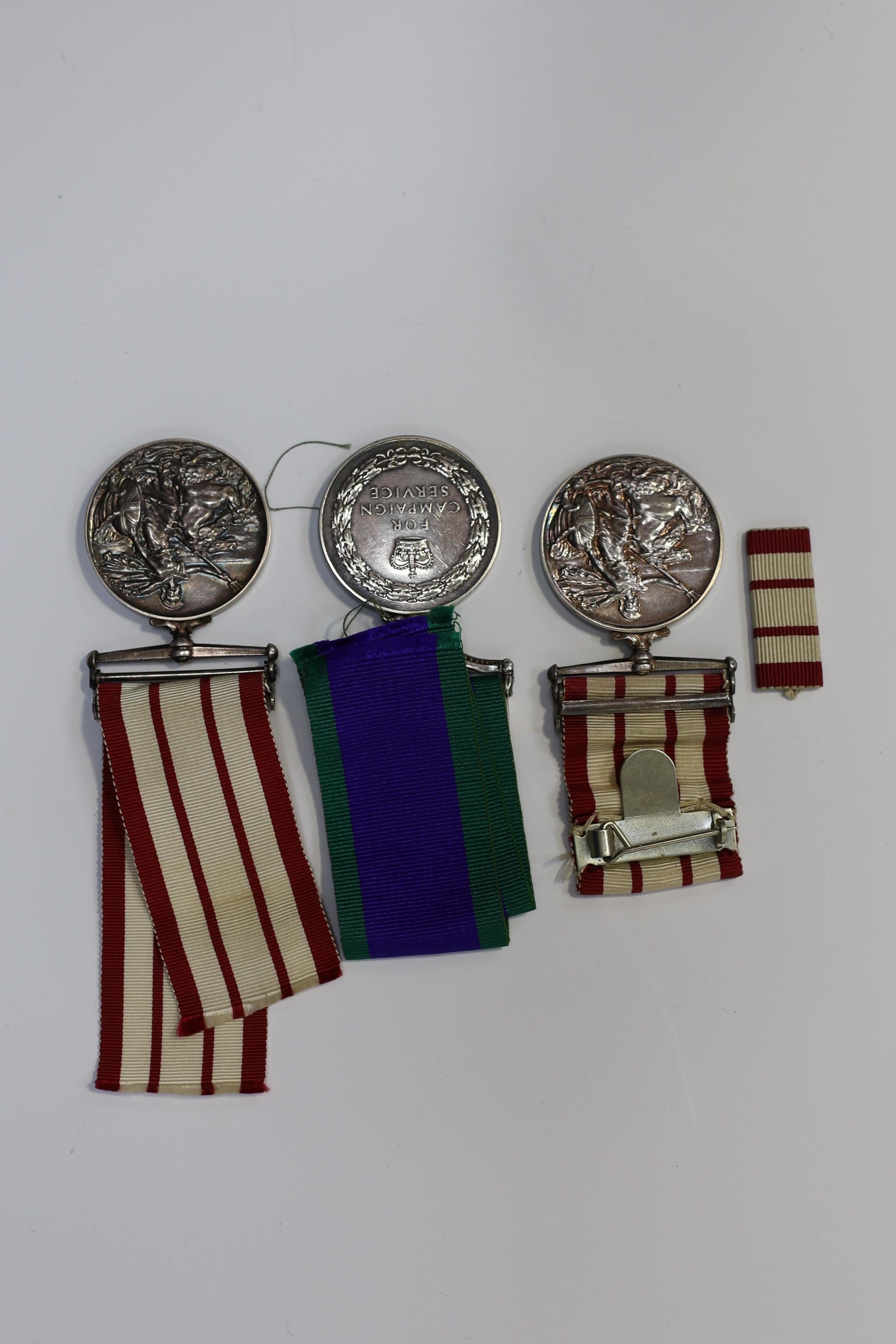 Three ERII Royal Navy medals; a Campaign Service Medal with a bar for Radfan awarded to J. Rush R.E.A.2 R.N., A Naval General Service Medal with a bar for the near East awarded to P/SKX J-C. Shaw M.(E.)1. R.N., plus a se